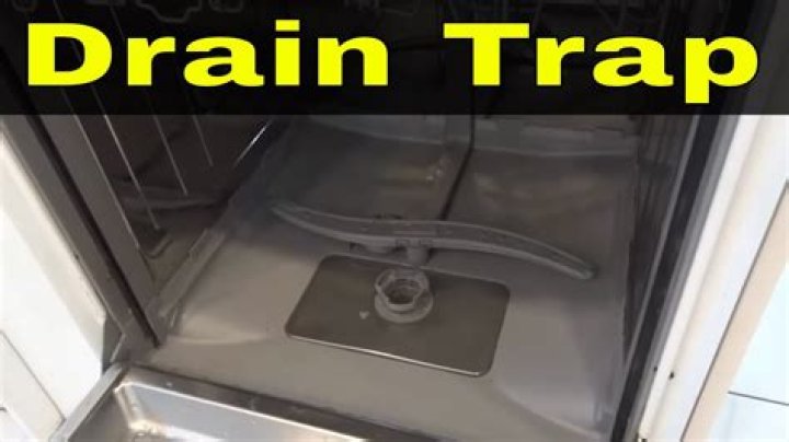 How do you clean a dishwasher food trap?