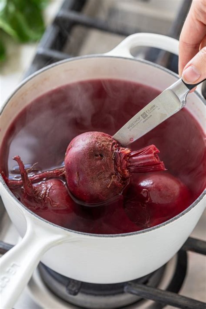 What do you add to water when boiling beets?