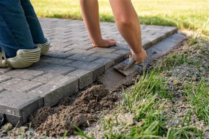 What do you put under pavers?