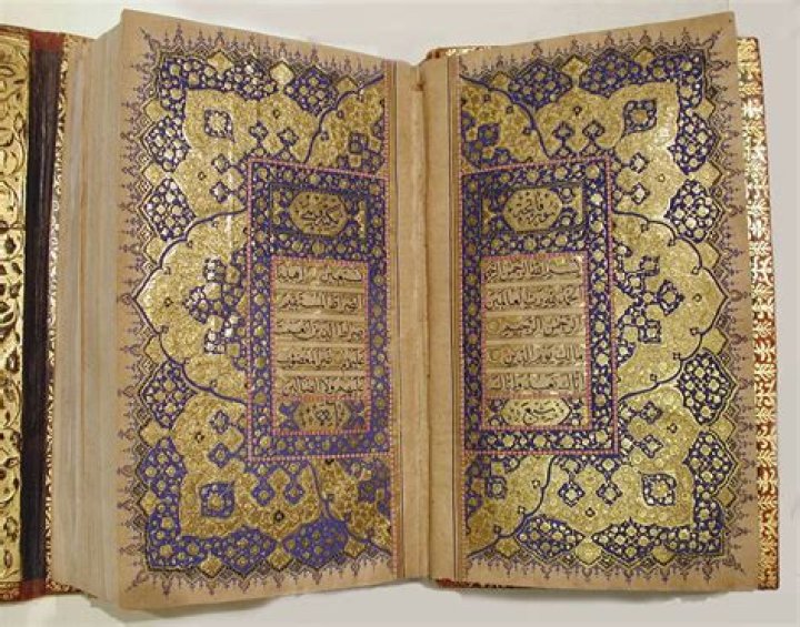 Who translated Quran first?